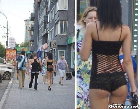 Une jolie brunette sans complexes se promene en shorty dans la rue au milieu des passants