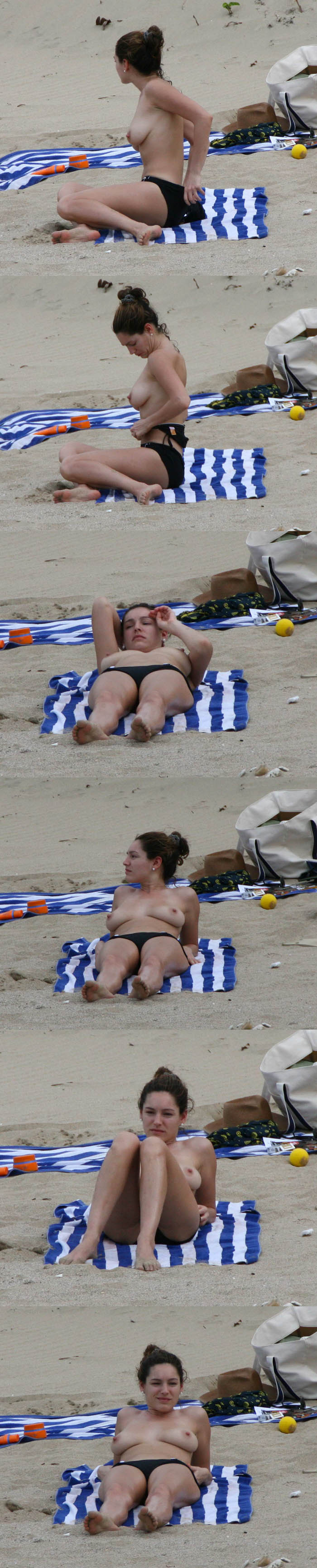 Kelly Brook topless : Kelly Brook seins nus fait bronzette tranquillement sur la plage