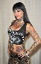 Michelle Bombshell la brune sexy, sulfureuse et tatouee